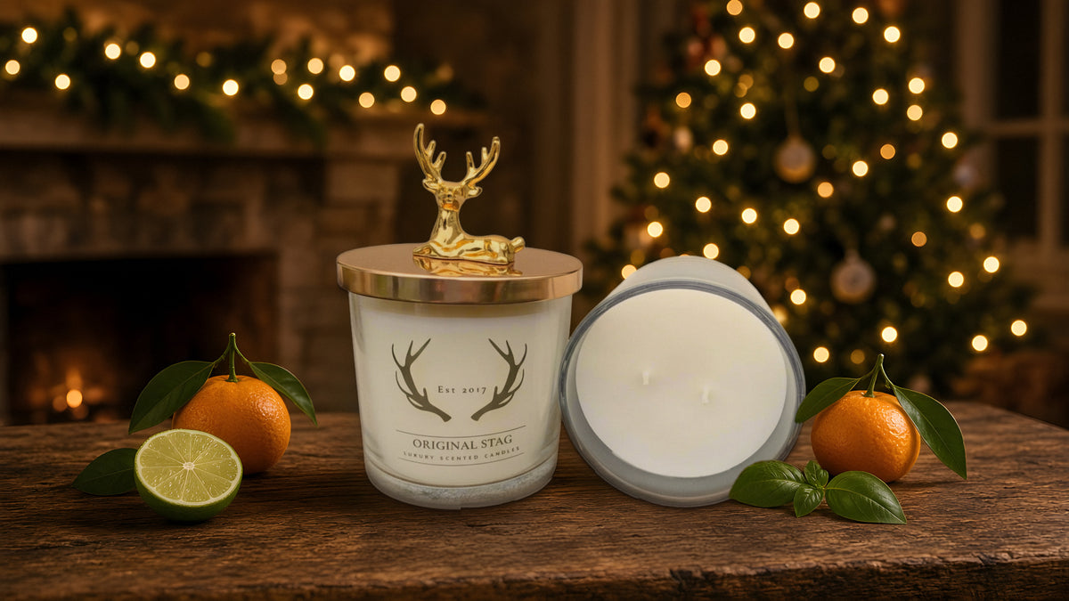 Original Stag Lime Basil & Mandarin candles by a lit Christmas tree