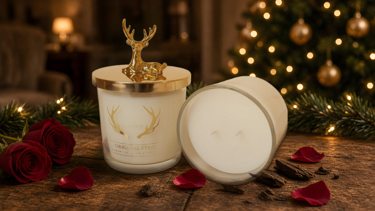 Original Stag Rose & Oud candles by a lit Christmas tree