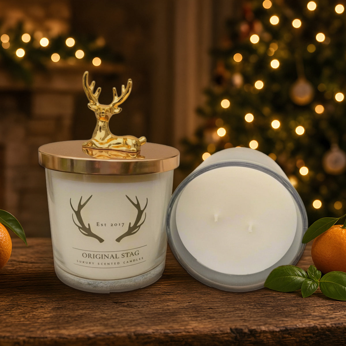 Lime Basil & Mandarin double wick scented candle with gold stag lid in a Christmas setting