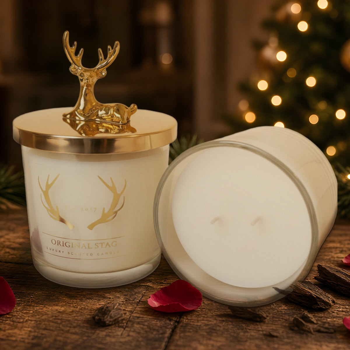 Rose & Oud double wick scented candle with gold stag lid in a Christmas setting